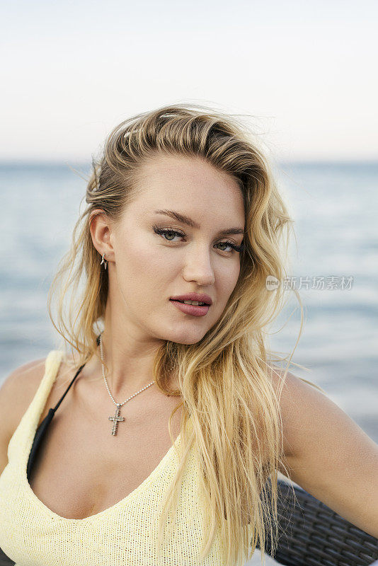 Portrait of attractive young woman on the beach